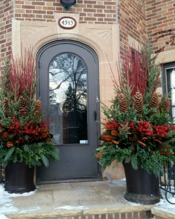 Large winter pots flanking front entry