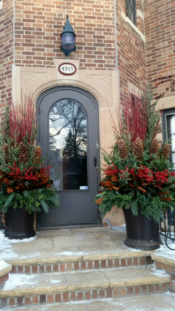 Large winter pots flanking front entry